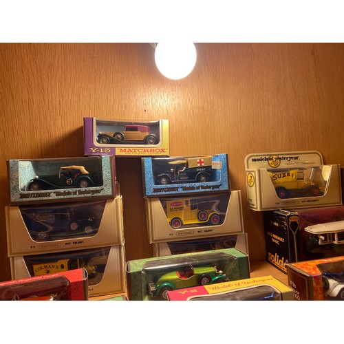 434A - A Shelf of Dinky and Matchbox boxed car models