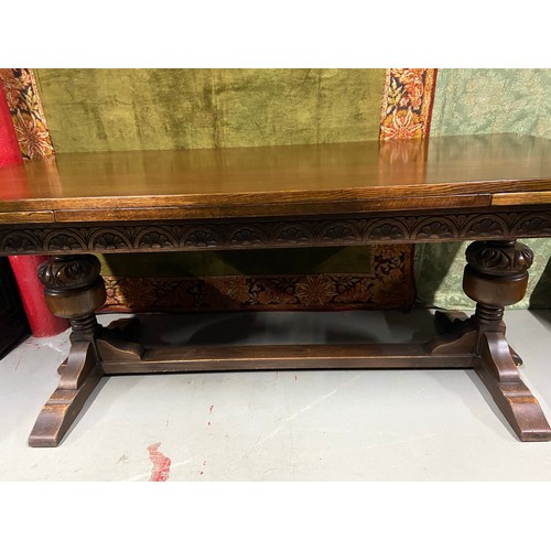 107B - A Large antique dining table with pull out leaves. Together with 6 antique red leather and stud fini... 