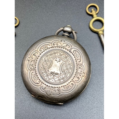 11J - A Birmingham silver cased pocket watch designed with an enamel face. Comes with two keys. [Spring ma... 