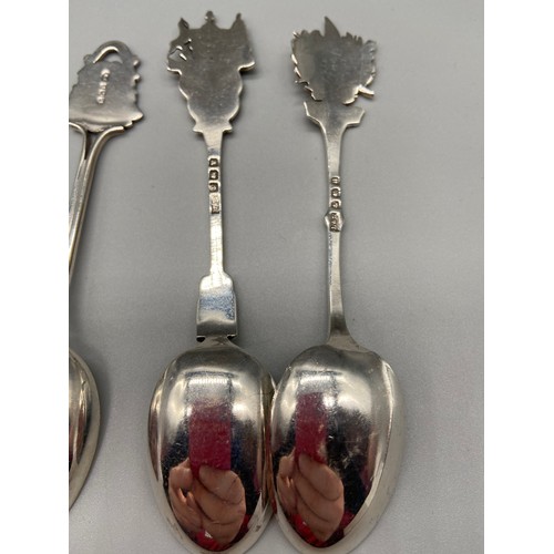 25 - A Lot of seven Birmingham Silver souvenir tea spoons. Some designed with enamel tops.