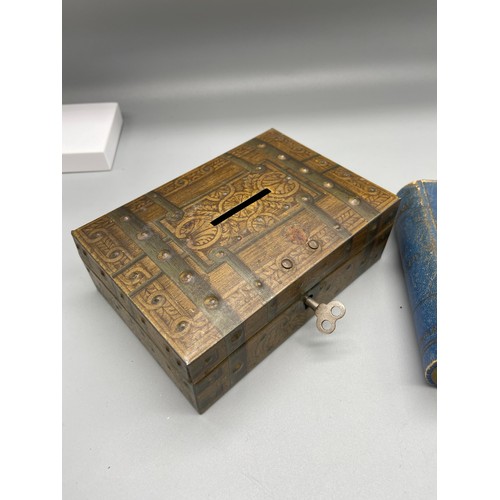 92 - A Vintage tin bank with key together with Lexicon card game.