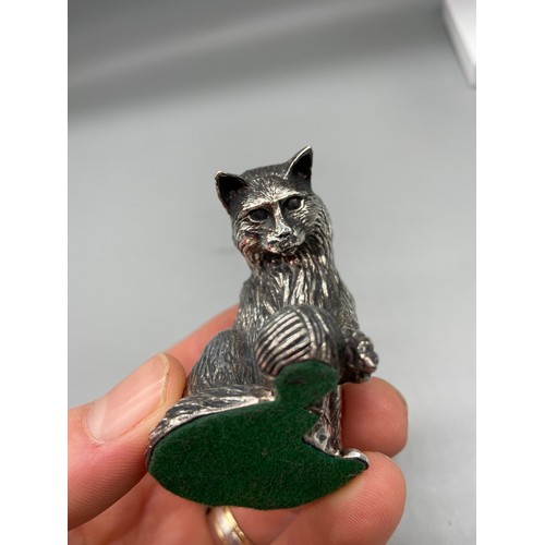 40 - A Sheffield silver [Filled] cat figure playing with a ball of string. [5.5.cm in height]