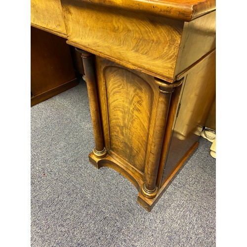 183 - An impressive Victorian pedestal sideboard. Designed with various exterior and interior drawers.