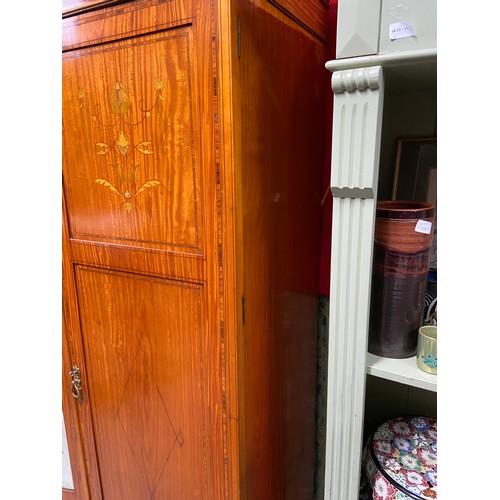 209 - A Late Victorian/Early Edwardian triple wardrobe, Designed with various inlaid panels and trims. Cen... 