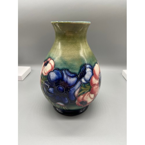 85 - A Moorcroft vase designed with hibiscus flowers. Impressed marking W. Moorcroft Potter to H.M. THE Q... 