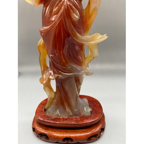 89 - A 19th Century Chinese hand carved red agate Geisha figurine. Sat upon a hardwood stand. [24.5cm in ... 