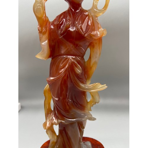 89 - A 19th Century Chinese hand carved red agate Geisha figurine. Sat upon a hardwood stand. [24.5cm in ... 