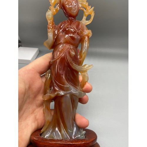 89 - A 19th Century Chinese hand carved red agate Geisha figurine. Sat upon a hardwood stand. [24.5cm in ... 