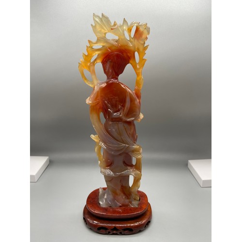 89 - A 19th Century Chinese hand carved red agate Geisha figurine. Sat upon a hardwood stand. [24.5cm in ... 