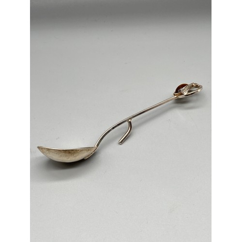 104 - A Vintage Edinburgh silver honey spoon, designed with a bee top with a tiger eye stone insert. 13cm ... 