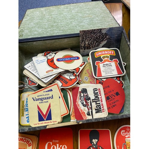 268 - Two tubs containing a collection of vintage pub advertising beer mats to include Tennent's Scottish ... 