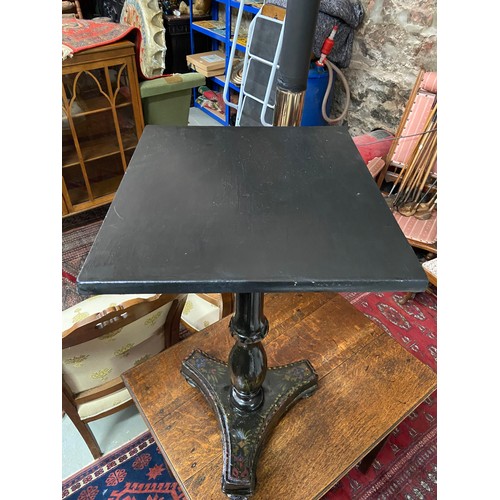 75A - A 19th century lacquered pedestalled side table.