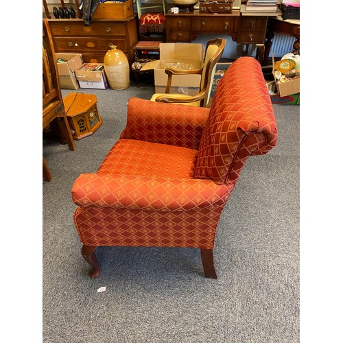 526 - An Antique style fire side arm chair.