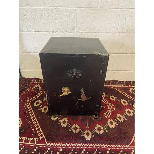 71E - An Antique shop safe produced by S. Withers & Co. West Bromwich. Designed with a brass hand handle. ... 