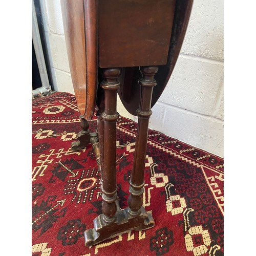 69A - A Victorian period walnut Yacht
Table or Sutherland with turned
supports. [H:58cm x L:72cm x W:52cm]