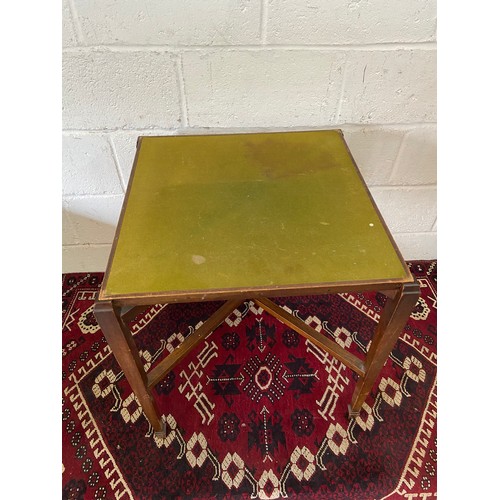 50D - A 20th century folding card table. [H:66cm x 56cm2]