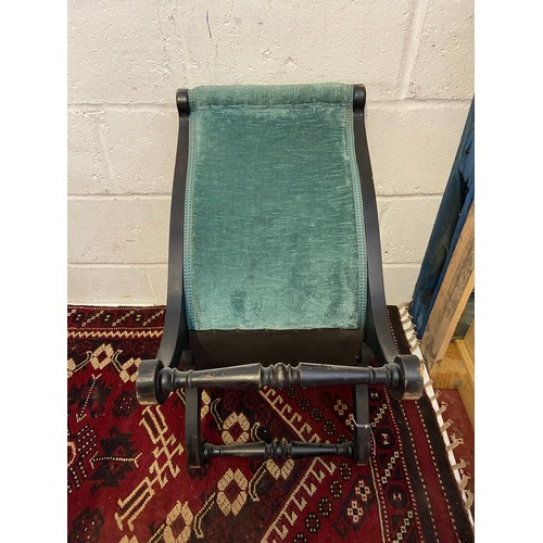 100A - A 19th century dark wood framed Childs nursery lounge chair.