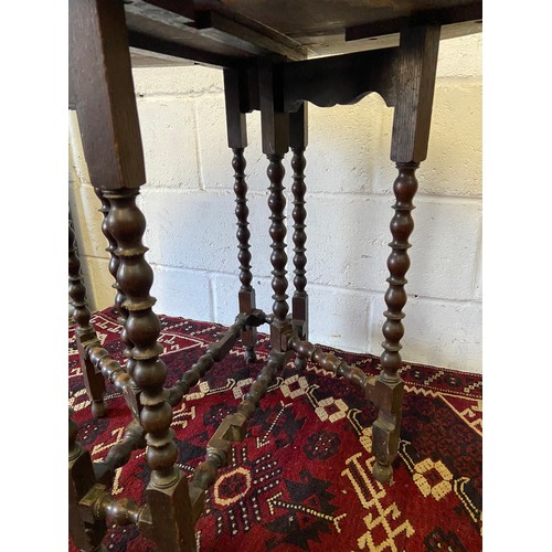 88A - An early 20th century oval drop end kitchen table, Carved trims and bobble designed legs. [66cm heig... 