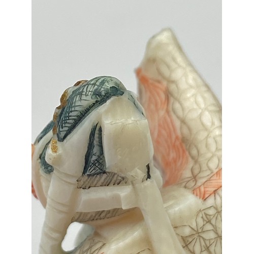 46J - A Japanese Meiji period ivory carved scholar netsuke. Signed to the base. [Slight chip to back of he... 