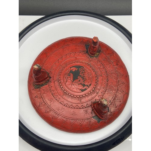 161J - A Chinese Cinnabar lidded box containing an ink stone, together with an antique three foot pedestal ... 