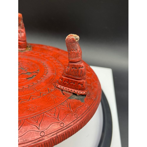 161J - A Chinese Cinnabar lidded box containing an ink stone, together with an antique three foot pedestal ... 