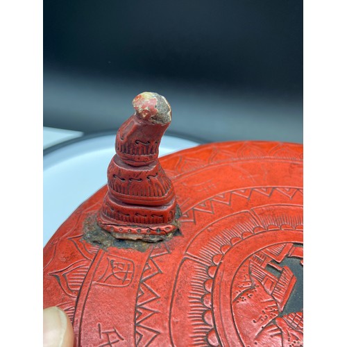 161J - A Chinese Cinnabar lidded box containing an ink stone, together with an antique three foot pedestal ... 