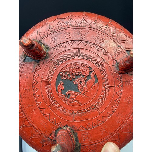 161J - A Chinese Cinnabar lidded box containing an ink stone, together with an antique three foot pedestal ... 