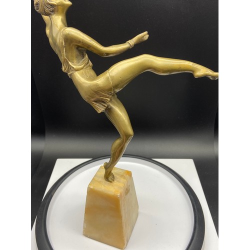 134J - An Art Deco gilt bronze dancing semi nude lady figurine. Displayed upon an alabaster base. Signed Va... 