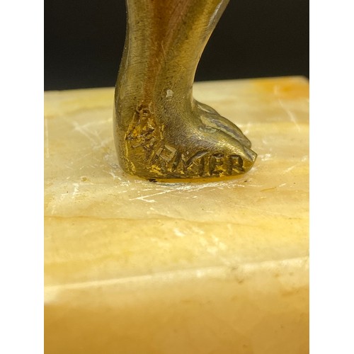 134J - An Art Deco gilt bronze dancing semi nude lady figurine. Displayed upon an alabaster base. Signed Va... 