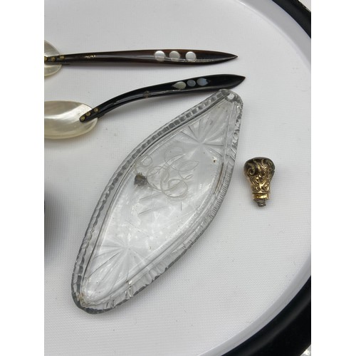 133J - Two silver and enamel lids, Two mother of pearl and bone spoons and crystal cut perfume bottle.