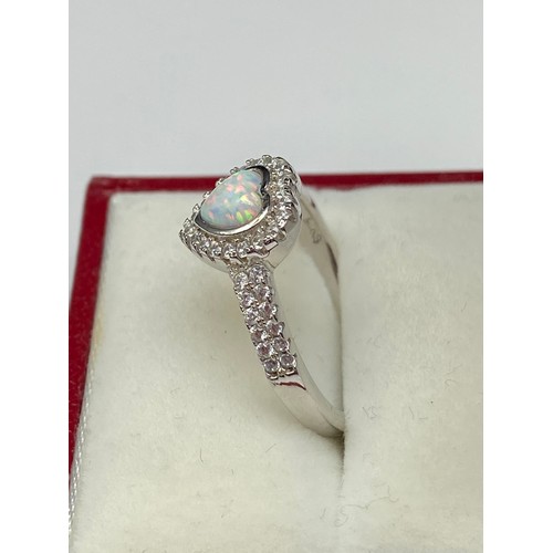 103J - A Silver and CZ Ring with Central heart shaped Opal. [Ring size P1/2]