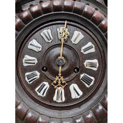 21 - An Impressive Antique German Blackforest wall clock. [68cm in length]