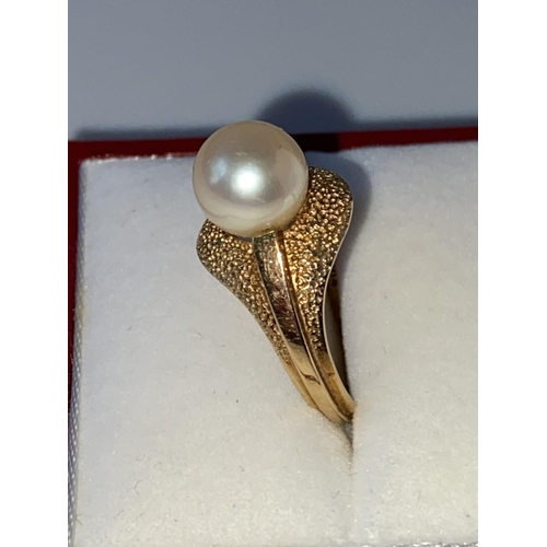 3J - A ladies 14k gold ring set with a single pearl setting, stamped [K14], [3.60g] [size L]