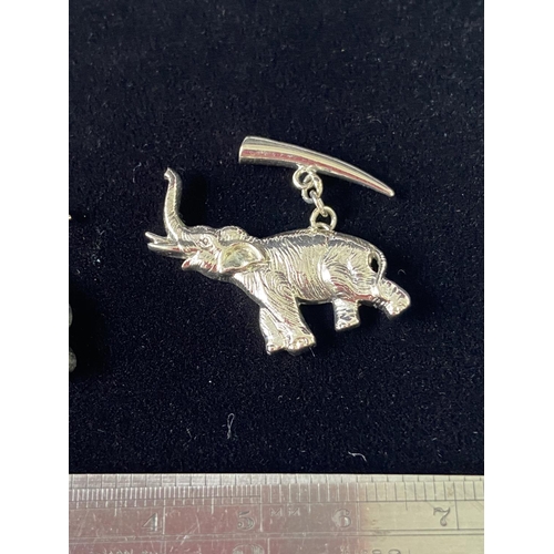 91J - A Pair of silver elephant cufflinks.