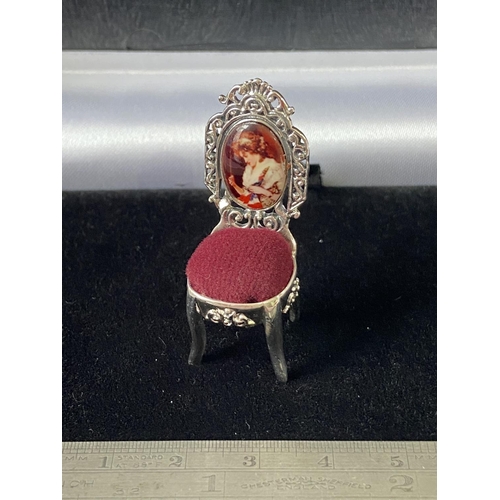 100J - A Silver chair pincushion with enamel plaque [4.5cm in height]