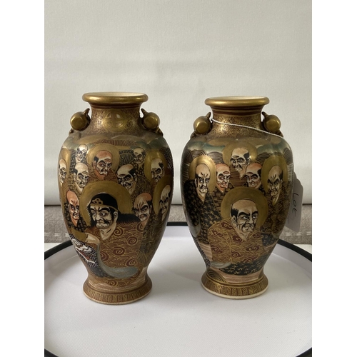 105J - A pair of Japanese satsuma hand painted urn style cases depicting various characters & dragon design... 