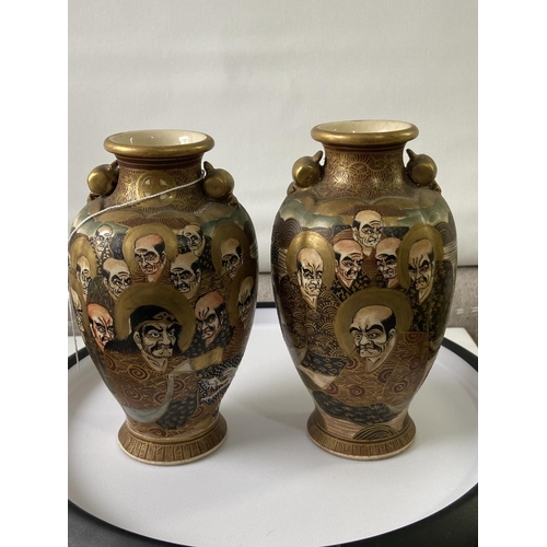 105J - A pair of Japanese satsuma hand painted urn style cases depicting various characters & dragon design... 