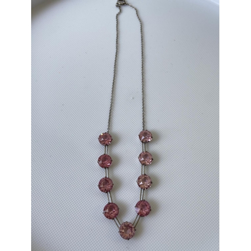 16J - A vintage white metal art deco necklace fitted with 9 large pink cut stones [length 35cm]