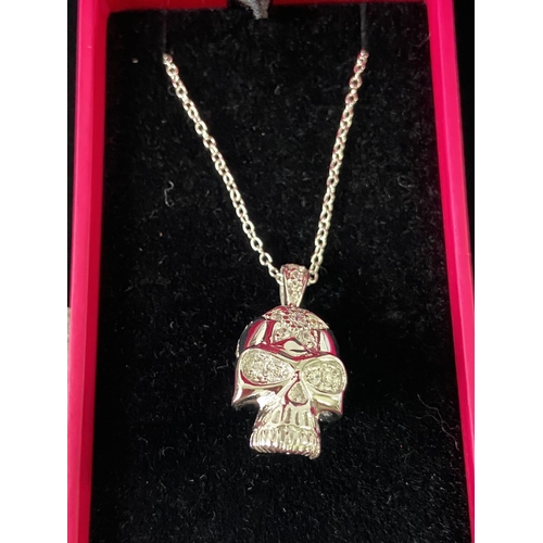 86J - A Silver and CZ Skull head pendant with necklace.