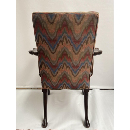 62 - A 19th century carver arm chair, supported on claw and ball feet. [back 95cm] [seat area 47cm]