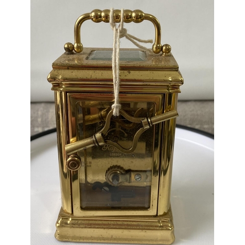 12J - Antique heavy brass carriage clock [Rapport London] [MVT No 1800] in a working condition and with ke... 