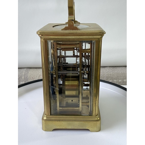 13J - Antique heavy brass carriage clock [makers name unreadable] in a working order with double drum move... 