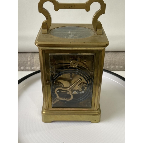 13J - Antique heavy brass carriage clock [makers name unreadable] in a working order with double drum move... 