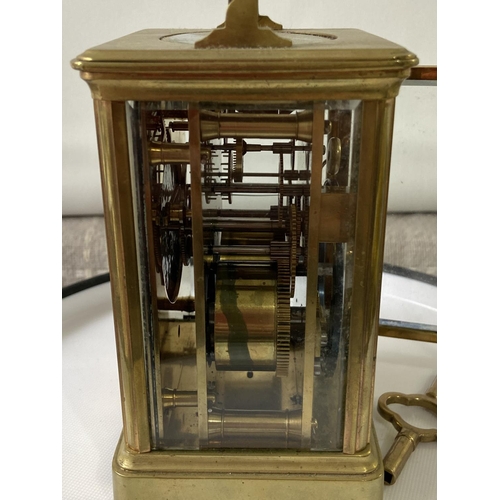 13J - Antique heavy brass carriage clock [makers name unreadable] in a working order with double drum move... 