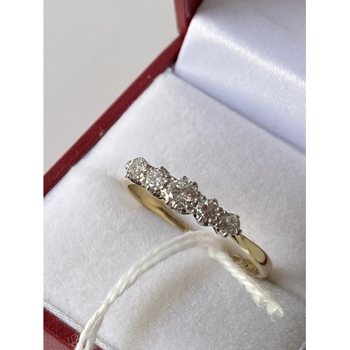 15J - An 18ct gold ladies ring set with 5 brilliant white diamonds [1 inclusion] [size T] [2.73g]