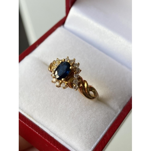 18J - An 18ct gold ladies sapphire & diamond cluster set ring [size L] [3.70g]