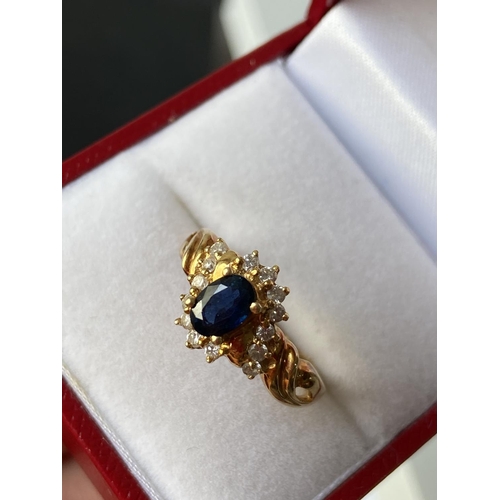 18J - An 18ct gold ladies sapphire & diamond cluster set ring [size L] [3.70g]