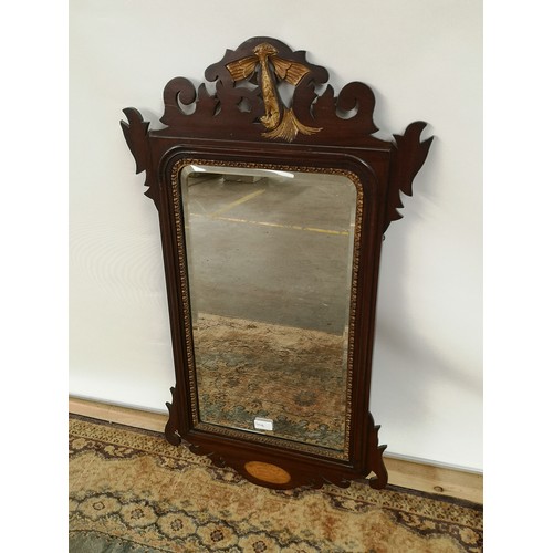 9 - A Georgian bevel edged and giltwood trim wall mirror with a pierced and carved wood extension to the... 