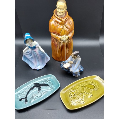 421 - Two poole pottery pin dishes, Monk decanter, Art Deco Lady figurine and mud man oriental figure.