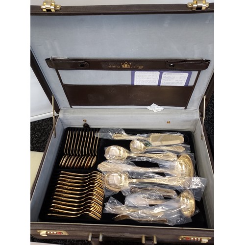 413 - A SBS Bestecke 24ct gold plated cutlery set with a fitted leather travel case.